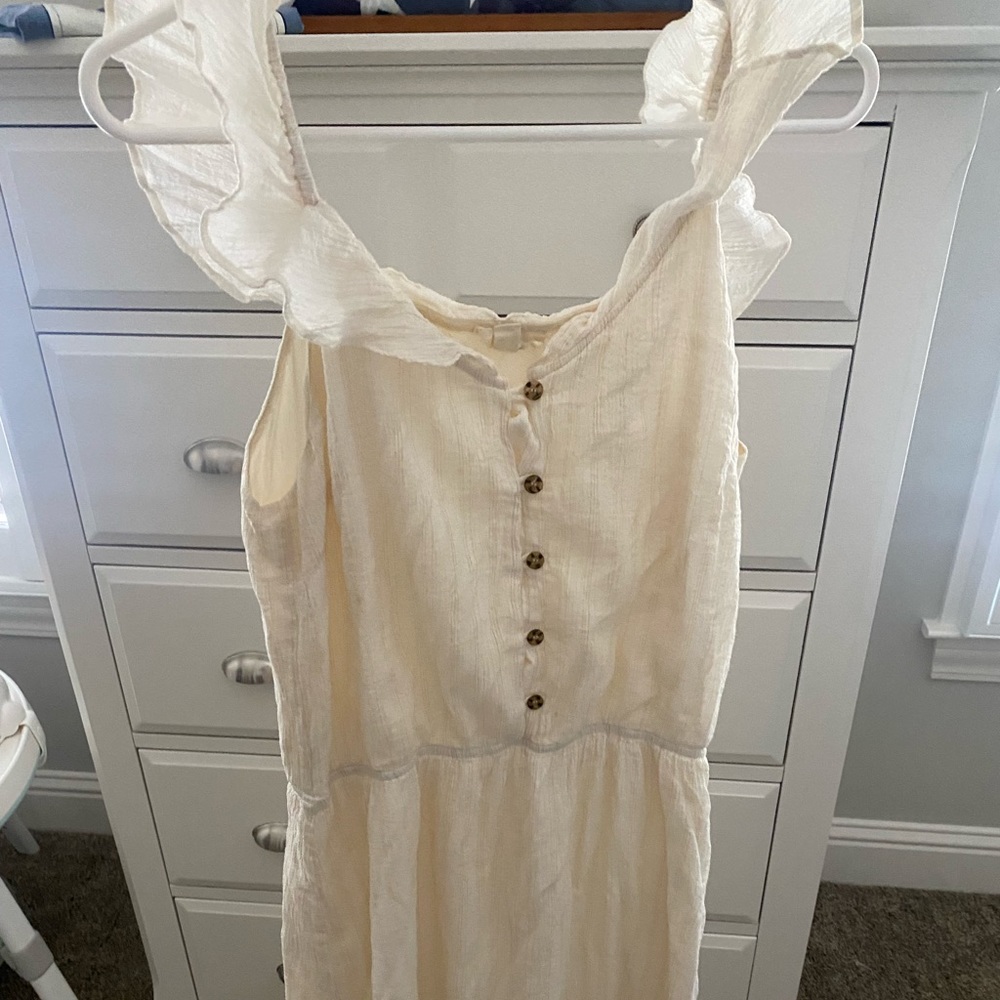 Cream gauze midi dress with flutter sleeves, elastic waist, button top.